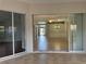 Spacious living room view shows tiled flooring leading to adjacent rooms and backyard at 541 Arena Dr, Davenport, FL 33837