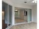 Living room area view showing tiled flooring leading to adjacent rooms and backyard at 541 Arena Dr, Davenport, FL 33837