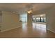 Bright living room with tile flooring, ceiling fan, with views of dining area and sunroom at 541 Arena Dr, Davenport, FL 33837