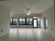 Living room featuring large glass doors and windows with tile flooring at 541 Arena Dr, Davenport, FL 33837
