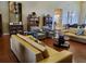 Comfortable lounge area with stylish sofas, armchairs, bookshelves, and elegant decor at 541 Arena Dr, Davenport, FL 33837