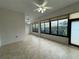 Sunroom features bright natural light from windows, and tiled floors at 541 Arena Dr, Davenport, FL 33837