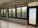 Bright sunroom featuring tile flooring, window blinds, and scenic backyard views at 541 Arena Dr, Davenport, FL 33837
