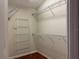Spacious walk-in closet with metal shelving for organized storage of clothes and accessories at 541 Arena Dr, Davenport, FL 33837