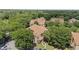 Aerial view of community showcasing mature trees, landscaped grounds, and well-maintained residences at 5436 E Michigan St # 7, Orlando, FL 32812