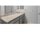 Modern bathroom featuring a spacious granite countertop, ample cabinetry, and sleek fixtures at 5436 E Michigan St # 7, Orlando, FL 32812