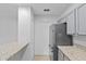 Eat-in kitchen featuring granite countertops and stainless steel appliances at 5436 E Michigan St # 7, Orlando, FL 32812