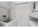 A laundry area with washer, dryer, and extra storage for household tasks, maximizing functionality at 5436 E Michigan St # 7, Orlando, FL 32812