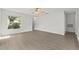 Open living area featuring wood-look floors and ample natural light at 5436 E Michigan St # 7, Orlando, FL 32812