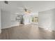 Large living space with laminate flooring, kitchen, and an expansive backyard view at 5436 E Michigan St # 7, Orlando, FL 32812