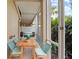 Cozy screened patio with outdoor seating and grill, perfect for relaxation and entertaining at 5436 E Michigan St # 7, Orlando, FL 32812