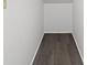 A compact storage area features durable wood-look flooring and ample vertical space for various organizational needs at 5436 E Michigan St # 7, Orlando, FL 32812