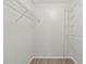This walk-in closet features white walls and shelving for storage and organization at 5436 E Michigan St # 7, Orlando, FL 32812