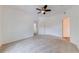 Large bedroom space featuring a ceiling fan and dual entryways at 5500 Metrowest Blvd # 203, Orlando, FL 32811