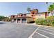 Exterior shot of a multi-unit complex with garage parking at 5500 Metrowest Blvd # 203, Orlando, FL 32811
