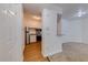 The kitchen with stainless steel appliances opens to the carpeted living room at 5500 Metrowest Blvd # 203, Orlando, FL 32811