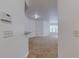 A neutral, carpeted living room featuring ample natural light from the windows at 5500 Metrowest Blvd # 203, Orlando, FL 32811