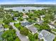 Stunning aerial view showcases a lakefront community with lush landscaping and beautiful homes at 609 Langholm Dr, Winter Park, FL 32789