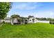 Expansive backyard with a covered patio, perfect for outdoor entertaining at 609 Langholm Dr, Winter Park, FL 32789