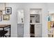 Charming bar area with a wine fridge, sink and shelving for glasses and drink accessories at 609 Langholm Dr, Winter Park, FL 32789