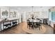 Stylish dining area with hardwood floors, modern decor, and an open layout for entertaining guests at 609 Langholm Dr, Winter Park, FL 32789