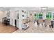 Open living space featuring a bar area, area, and dining area adjacent to the kitchen at 609 Langholm Dr, Winter Park, FL 32789