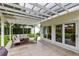 Inviting covered patio with comfortable seating and access to the home at 609 Langholm Dr, Winter Park, FL 32789