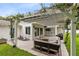 Cozy outdoor patio area with a pergola and comfortable seating at 609 Langholm Dr, Winter Park, FL 32789