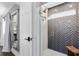 Modern shower with glass doors, gray herringbone tile, and a rainfall showerhead at 609 Langholm Dr, Winter Park, FL 32789