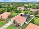 An aerial view of the home featuring a screened-in pool, set amongst lush green lawns at 6321 Clearmeadow Ct, Windermere, FL 34786