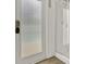 This bathroom features a clear glass shower door with a tiled wall shower and a door with privacy glass at 6321 Clearmeadow Ct, Windermere, FL 34786