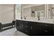 Beautiful bathroom featuring a double sink vanity, and a large illuminated mirror for a modern feel at 6321 Clearmeadow Ct, Windermere, FL 34786