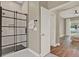 Elegant bathroom featuring a tiled shower and stylish finishes; adjoining the main bedroom at 6321 Clearmeadow Ct, Windermere, FL 34786