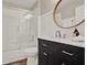 Bathroom with a vanity featuring a dark cabinet and a shower and tub combination at 6321 Clearmeadow Ct, Windermere, FL 34786