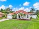 Charming single-story home featuring a well-manicured lawn and a classic red tile roof at 6321 Clearmeadow Ct, Windermere, FL 34786
