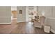 Elegant living room with hardwood flooring, neutral walls, and sliding doors leading to the pool area at 6321 Clearmeadow Ct, Windermere, FL 34786