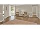 Bright living room featuring hardwood flooring, neutral walls, and access to the outdoor patio at 6321 Clearmeadow Ct, Windermere, FL 34786
