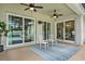 Covered patio with ceiling fans provides the perfect place to relax and entertain outdoors with a tiled patio at 6321 Clearmeadow Ct, Windermere, FL 34786