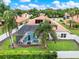 Aerial view of the backyard oasis with a screened-in pool and patio at 6321 Clearmeadow Ct, Windermere, FL 34786