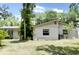 Expansive backyard featuring well-maintained lawn, mature trees, and the home's exterior with windows at 637 15Th St, Debary, FL 32713