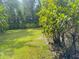 Backyard featuring green lawn and mature trees at 637 15Th St, Debary, FL 32713