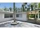 Backyard featuring concrete yard, attached carport, and lush landscaping at 637 15Th St, Debary, FL 32713
