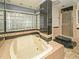 Spacious bathroom offers large tub and glass-blocked window for natural light at 637 15Th St, Debary, FL 32713