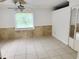 Bright bedroom with neutral tile flooring, natural lighting, and double closet at 637 15Th St, Debary, FL 32713