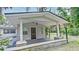 Inviting covered front porch with sturdy columns and freshly painted exterior offers curb appeal at 637 15Th St, Debary, FL 32713