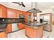 Bright kitchen boasts an island, wood cabinets, and modern stainless steel appliances at 637 15Th St, Debary, FL 32713