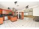 Modern kitchen with stainless steel appliances, wood cabinets, and granite countertops at 637 15Th St, Debary, FL 32713