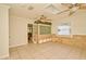 Open floor plan with tile floors, ceiling fan, and an opening with glass block to another room at 637 15Th St, Debary, FL 32713