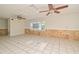 Bright living room with tile flooring, ceiling fans and ample natural light from large windows at 637 15Th St, Debary, FL 32713