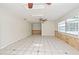 Bright living room with tile flooring, ceiling fans and natural light from windows at 637 15Th St, Debary, FL 32713